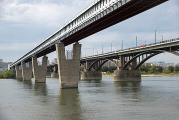 Fototapeta premium Two bridges: Oktyabrsky and metromost across the Ob River. Novosibirsk, Russia