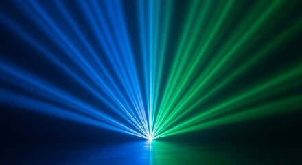 Vibrant blue and green laser beams converge from a central point against a black background