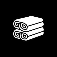 Stack of books with a chain on top.