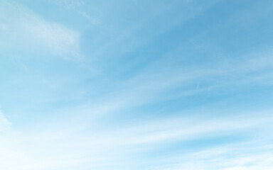 Blue Sky with Thin White Cirrus Clouds Streaking Across the Frame