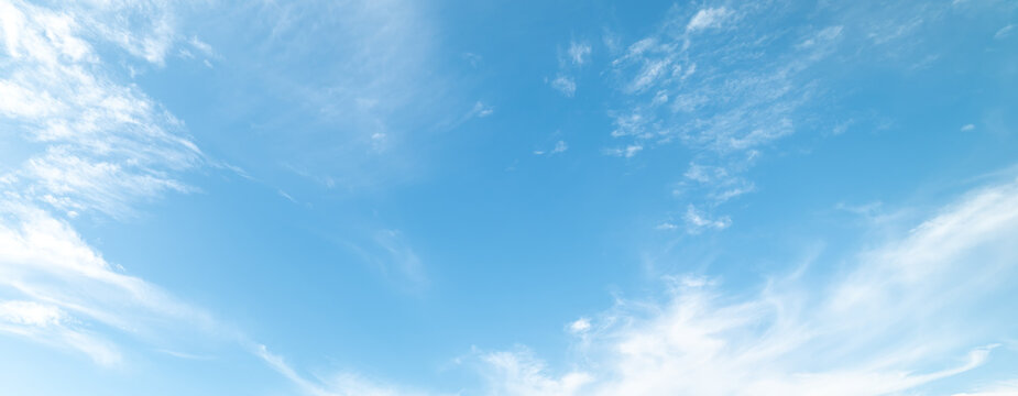Scattered white clouds in the blue sky