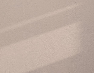 Obraz premium Peach dust wall background rough texture textured shadow and light color of the year 2026, trendy muted tone 