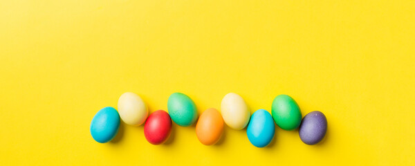Obraz premium holiday preparation Multi colors Easter eggs on colored background . Pastel color Easter eggs. holiday concept with copy space