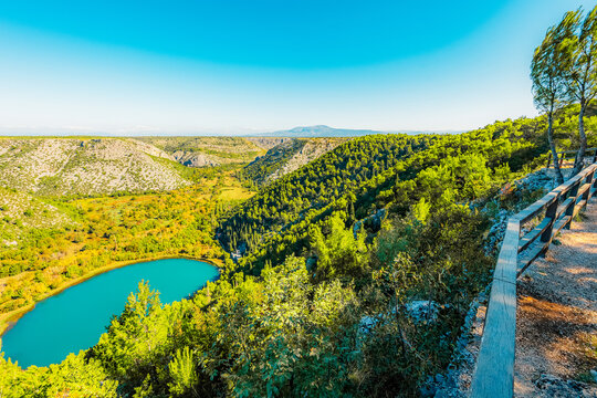 view Torak of the confluence where the Cikola river lake tributary joins the Krka river canyon, Krka National Park, Dalmatia, Croatia.