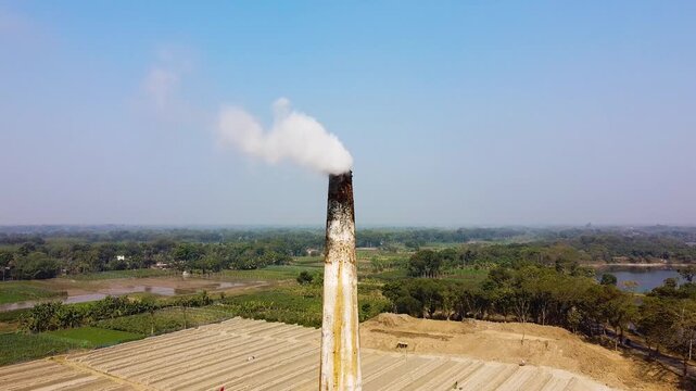 High Angle View of Brickfield with Workers and Chimney Smoke