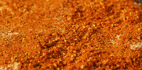 Close-up macro vibrant spice mix with orange tones