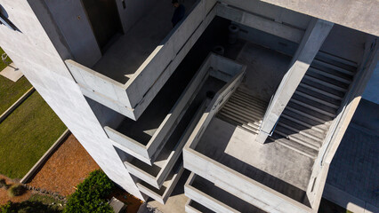 Aerial view looking down at outdoor stairs in modern concrete building 