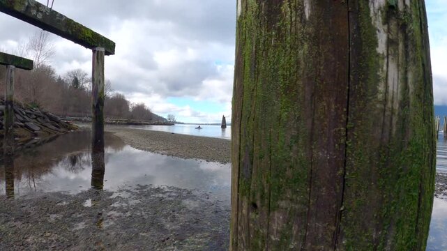 Barnet Marine Park Shoreline Pier Ruins Canada 4K UHD.Ruins of a pier along the Barnet Marine Park shoreline. Burnaby, British Columbia, Canada. 4K, UHD.

