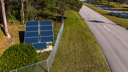 Solar panels installed on holding brackets next to road