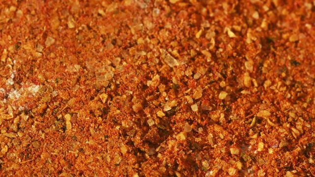 Close-up macro vibrant spice mix with orange tones