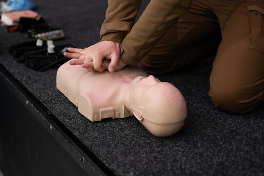 Hands-on CPR practice with training manikin