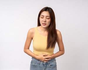 A woman had a stomach ache and gastritis. She put her hand on her stomach and squeezed it to relax and soothe. Unwell unhealthy female menstrual cramps on isolated white background.