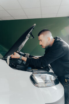 Skilled technician working on automotive customization