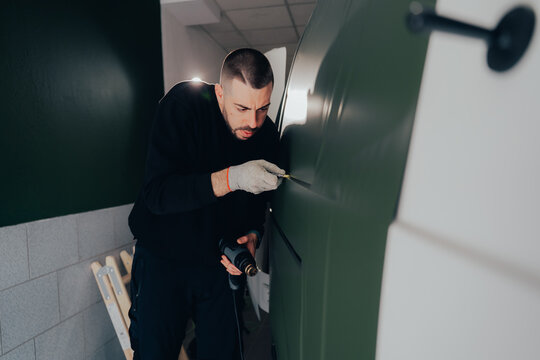 Skilled technician working on vehicle customization process