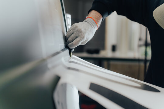 Vehicle branding and customization process in workshop