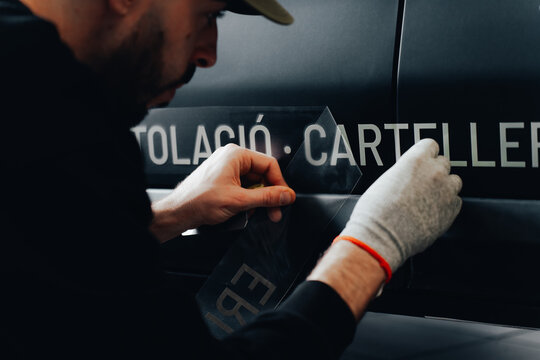 Skilled worker on vehicle branding and customization
