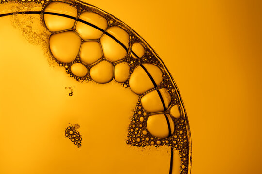 Macro view of soap bubbles on orange background