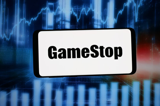 Stuttgart, Germany - 02-09-2026: In this photo illustration, the logo of US video game retail company GameStop Corp. is displayed on a smartphone in front of abstract background on computer screen.