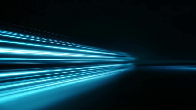 Glowing blue light streaks move dynamically across dark background, generating abstract, futuristic, and energetic atmosphere with motion, speed, and dynamic energy, perfect for technology concepts