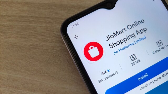 JioMart Online Shopping App on smartphone screen with 4.4 star rating