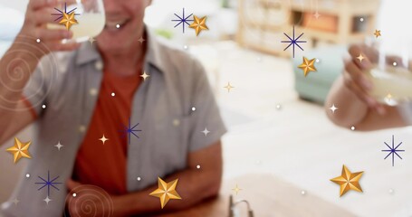 Lifting man in short-sleeve shirt holding stemless glass at home, showing glasses and star overlays