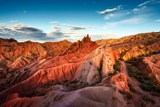 Fairy Tale Canyon or Skazka Canyon landscape with sandstone rock formation and hills in evening at Kyrgyzstan