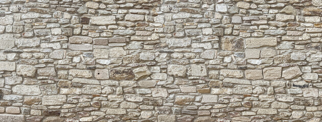 Old stone wall texture background presenting rough masonry pattern © Kornienko Alexandr