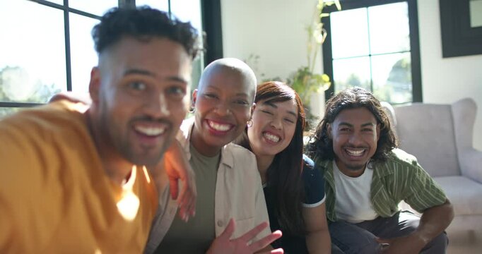Diverse friends posing on couch, camera-holder extending smartphone, leaning in, capturing laughter