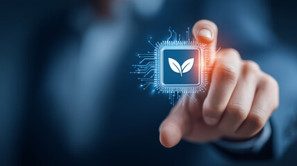 Business hand selecting an eco microchip with a leaf icon representing sustainable computing innovation.
