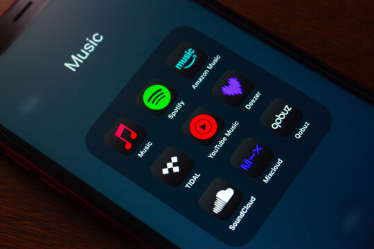 Quito, ECUADOR - Oct 6 2025 : Close up of smartphone displaying music streaming apps include Apple Music, Spotify, Amazon Music, Tidal, YouTube Music, Deezer, SoundCloud, Mixcloud and Qobuz.