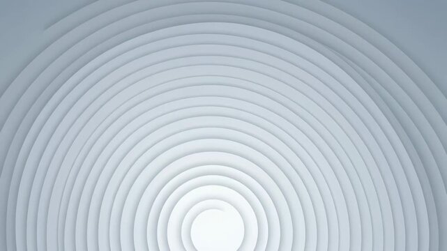 Gentle light moves across an abstract background. Concave white layers create mesmerizing concentric circles.