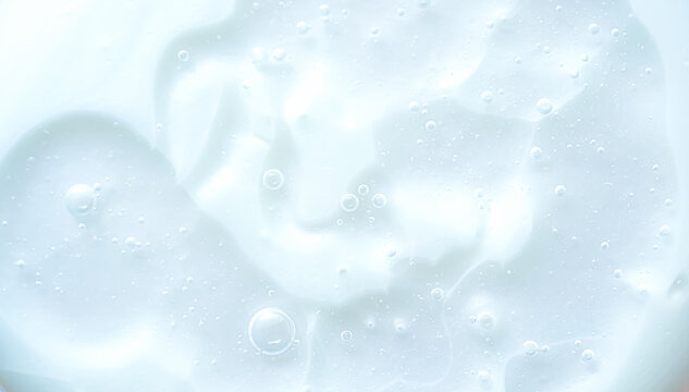 Soft macro background of milky liquid with air bubbles and smooth gradients. Clean minimal texture ideal for skincare, cosmetic branding, hydration concepts, science, and modern wellness design