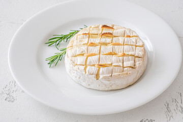 Baked camembert with toasted ciabatta garlic and rosemary garnish