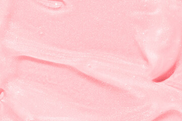 Fototapeta premium Smooth pink texture with shimmery sparkle, ideal for cosmetic or skincare background and product presentation.