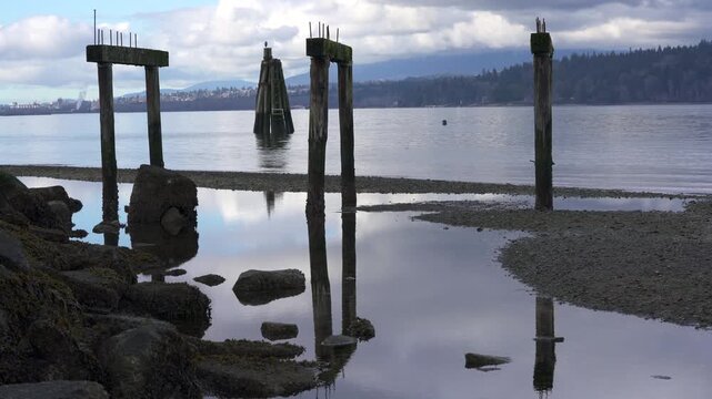 Barnet Marine Park Burrard Inlet Pier Ruins 4K UHD..Ruins of a pier along the Barnet Marine Park shoreline. Burnaby, British Columbia, Canada. 4K, UHD.
