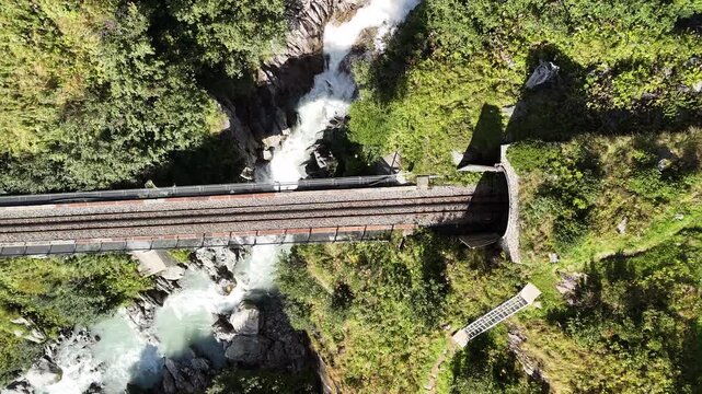 Railway Bridge Through Scenic Mountain Tunnel Over River