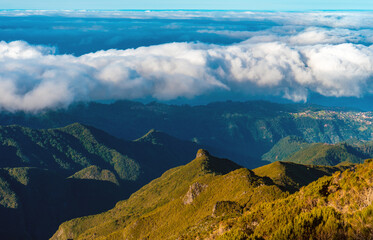 Fototapeta premium Aerial view of winding mountain road above the clouds.