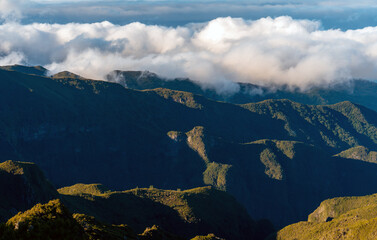 Fototapeta premium Aerial view of winding mountain road above the clouds.