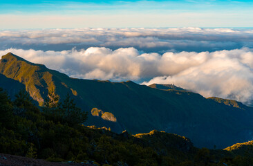 Fototapeta premium Aerial view of winding mountain road above the clouds.