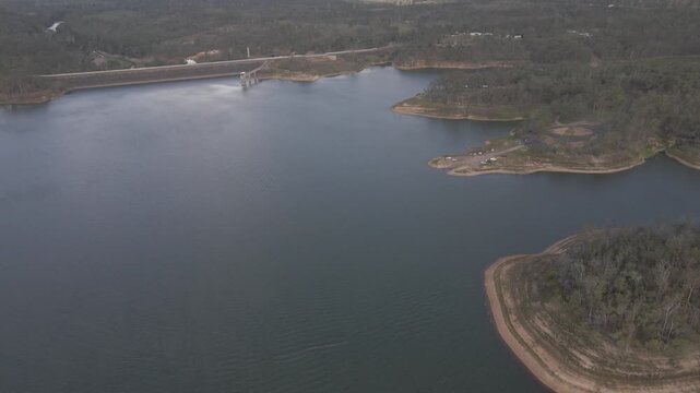 Fly towards aerial of Lake Monduran, Fred Haigh dam and boat ramp