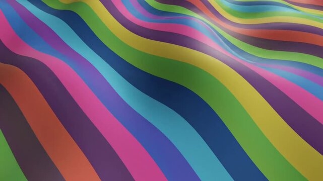 Colorful waves of fabric in bright shades of blue, green, pink, and yellow flowing together on a flat surface