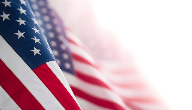 A close-up view of the American flag waving in the wind with a bright white background