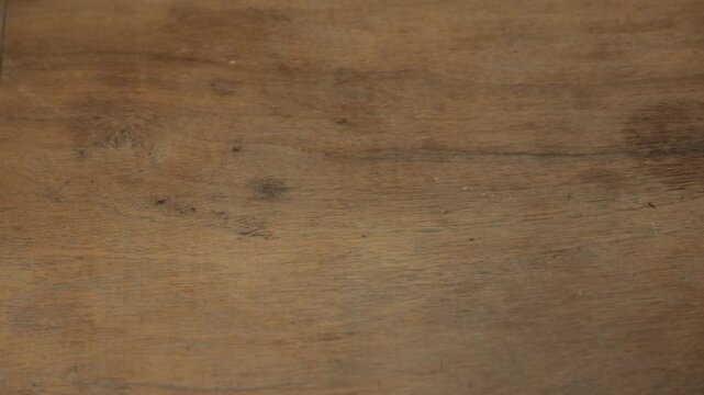 Rolling Polyhedral Dice for Role Playing Games, close-up 4K shot of a hand scattering various RPG dice on a table, including d20, d12, d10, d8, d6, and d4. Concept of tabletop gaming, fantasy