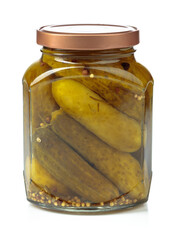 Homemade pickled cucumbers in a glass jar isolated on a white background.