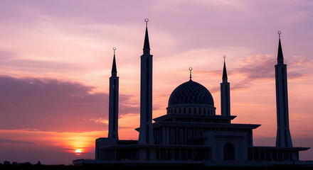 Fototapeta premium Serene mosque silhouette at sunset with majestic architecture and tranquil atmosphere.