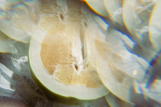 Artistic cinematic view of a fresh pomelo fruit slice