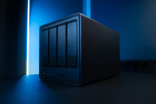 Nas Network Storage Enclosure With Five Drive Bays Under Blue Neon Lighting