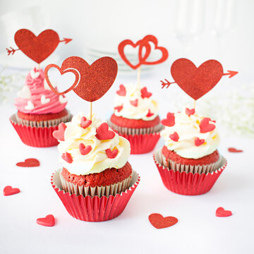 Valentine Red Velvet Cupcakes with Cream Frosting and Heart Decorations