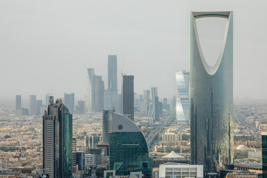 Contemporary cityscape with futuristic high rise architecture, corporate towers and dense urban downtown development representing economic growth, Al Olaya, Riyadh, Saudi Arabia