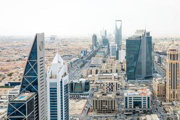 Contemporary cityscape with futuristic high rise architecture, corporate towers and dense urban downtown development representing economic growth, Al Olaya, Riyadh, Saudi Arabia